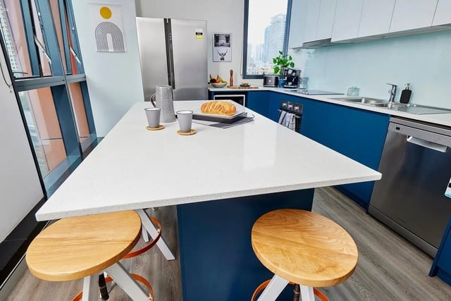 Kitchen island with stools and bread kitchen at Scape Darling Square in Sydney Student Accommodation