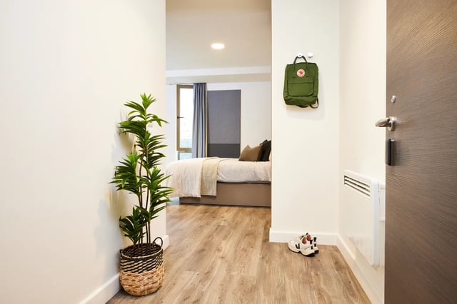 Plant backpack shoes and bed Bedroom at Vita Student Newcastle Westgate in Newcastle Upon Tyne Student Accommodation