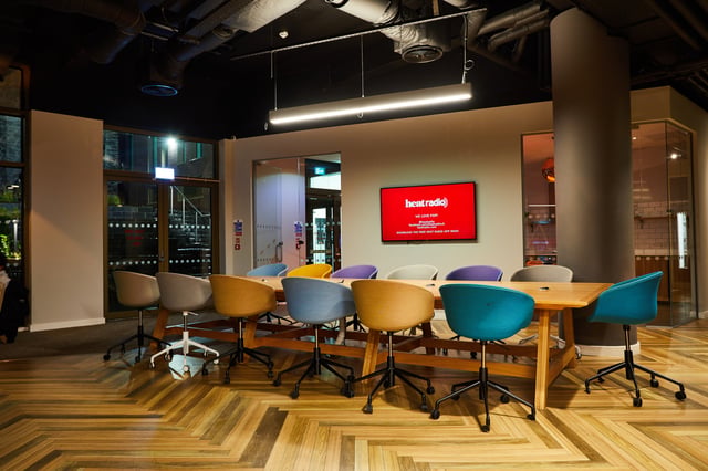 Conference room with modern chairs and television display. at Vita Student Newcastle Westgate in Newcastle Upon Tyne Student Accommodation