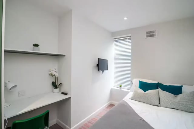 Desk with lamp plant and bed with pillows bedroom at 80 Beresford Street in Stoke-On-Trent Student Accommodation