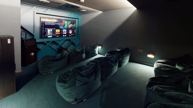 Beanbag chairs facing large screen TV gaming room at The Residence in Coventry Student Accommodation