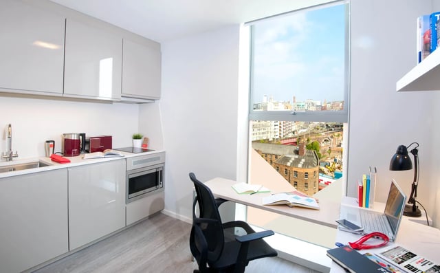 Modern student accommodation kitchen desk and view. at Vita Student Manchester First Street in Manchester Student Accommodation