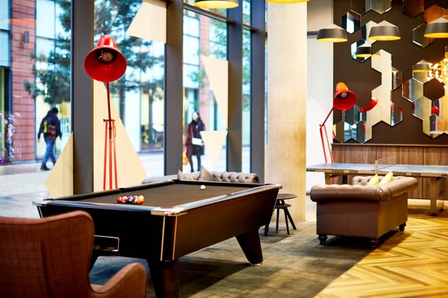 Pool table seating and ping pong table common area at Vita Student Manchester First Street in Manchester Student Accommodation