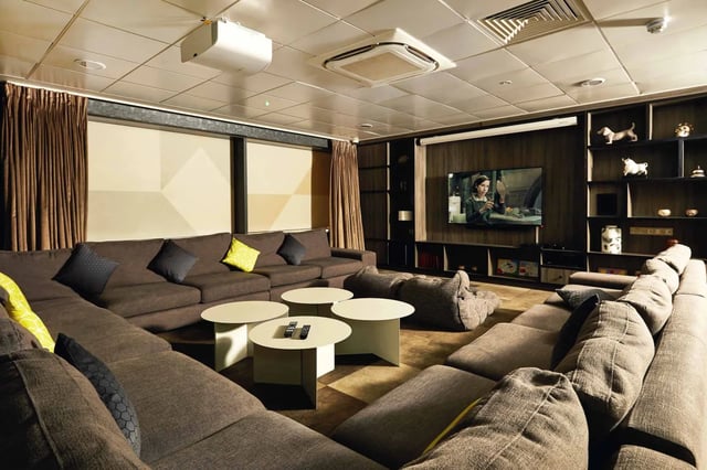 Sectional sofas, tables, and beanbags in living area. at Vita Student Manchester First Street in Manchester Student Accommodation