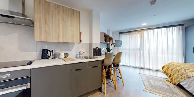 Kitchen with kettle sink and two bar stools kitchen area at Canvas Coventry Arundel House in Coventry Student Accommodation