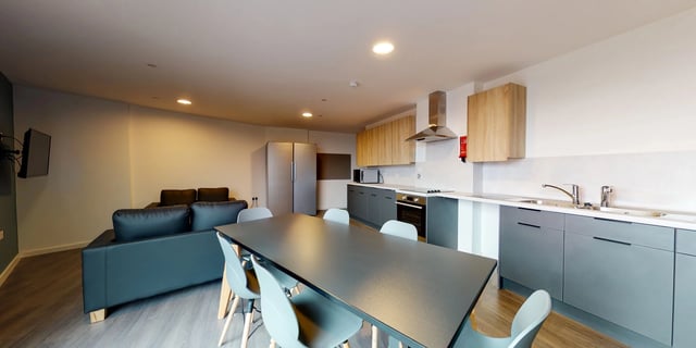 Kitchen island with chairs, sofa, fridge, oven. Living room kitchen. at Canvas Coventry Arundel House in Coventry Student Accommodation
