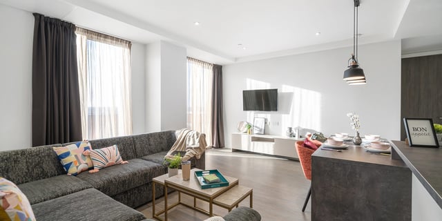 Sofa TV media unit and dining table living room at Canvas Coventry City Club in Coventry Student Accommodation