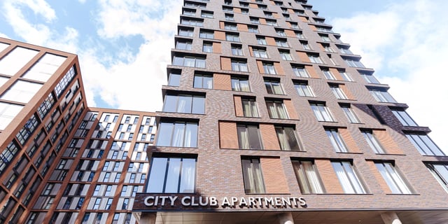 Modern brick apartment buildings with many windows exterior at Canvas Coventry City Club in Coventry Student Accommodation