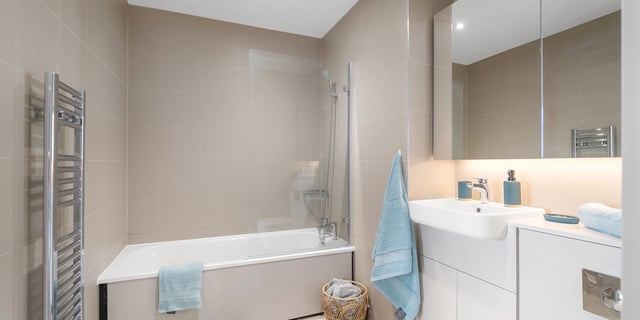 Modern bathroom with white vanity and bathtub Bathroom at Canvas Coventry City Club in Coventry Student Accommodation