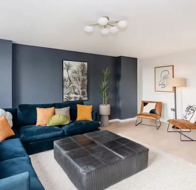 Blue sofa large ottoman modern chairs art living room at Zinc Quarter in Bristol Student Accommodation