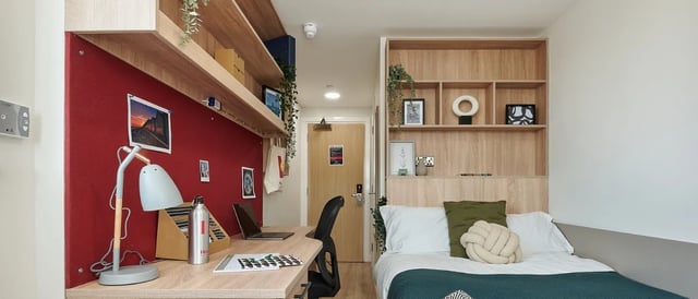 Desk lamp laptop water bottle shelves bed bedroom at Christchurch Road in Bournemouth Student Accommodation