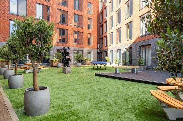 Bear statue ping pong table picnic benches exterior at Riverside House - Manchester in Salford Student Accommodation