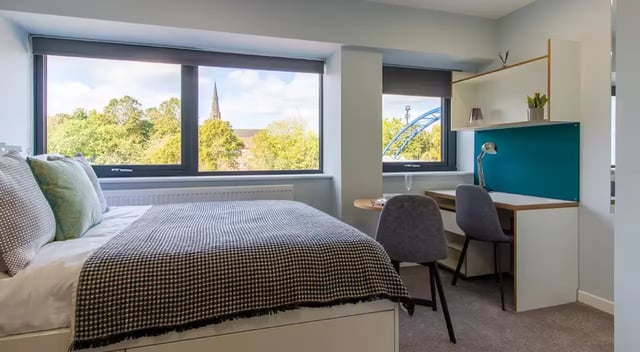 Bed desk and chairs with large windows bedroom at Urban Student Village in Coventry Student Accommodation