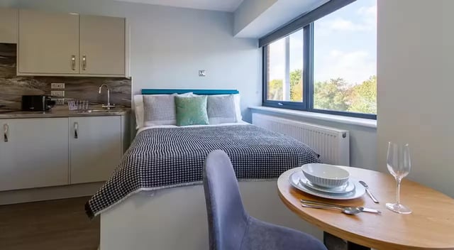 Bed kitchen table chair and dining setting bedroom at Urban Student Village in Coventry Student Accommodation