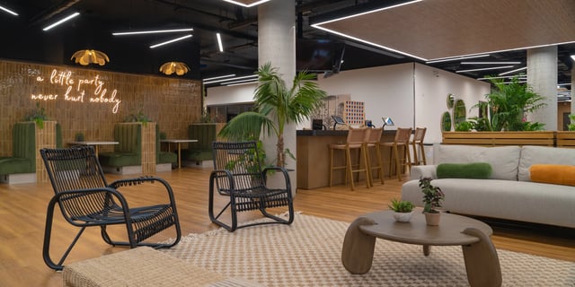 Lounge area with sofas chairs bar and seating living room at Canvas Manchester in Manchester Student Accommodation