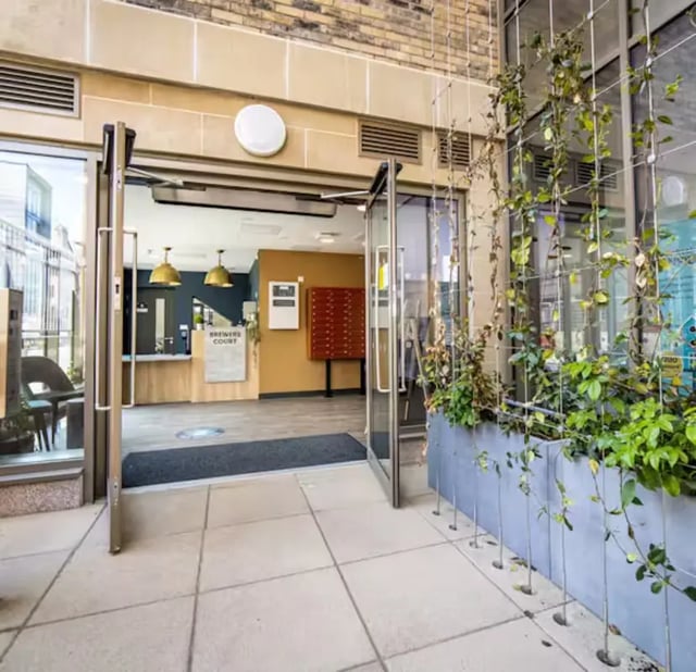 Building entrance with reception mailboxes plants exterior at Brewer's Court in Edinburgh Student Accommodation