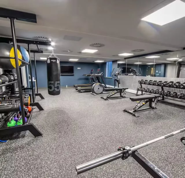 Gym equipment weights punching bag treadmills fitness center at Brewer's Court in Edinburgh Student Accommodation