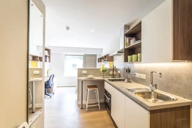 Modern student kitchen with dining bar living room at Brewer's Court in Edinburgh Student Accommodation