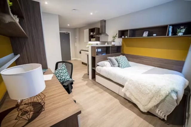Bed desk kitchen area and shelving bedroom at Brewer's Court in Edinburgh Student Accommodation