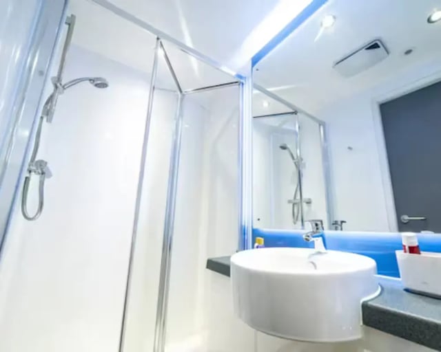 Shower cubicle sink and mirror bathroom at Brewer's Court in Edinburgh Student Accommodation