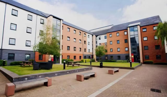 Courtyard with buildings picnic tables and seating exterior at Riverside Point in Nottingham Student Accommodation