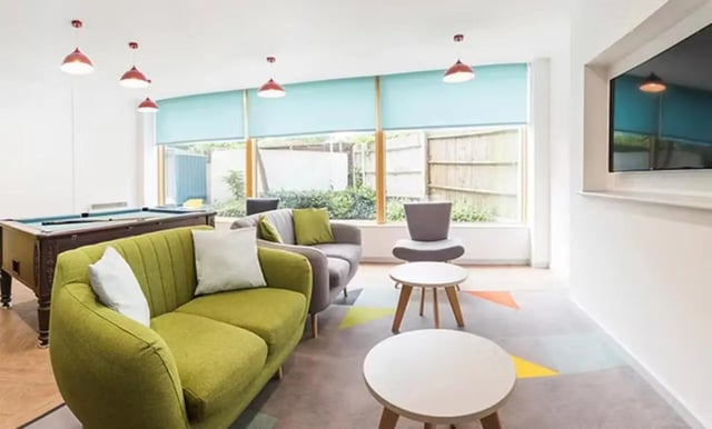 Pool table sofas coffee tables living room at Charles Morton Court in London Student Accommodation