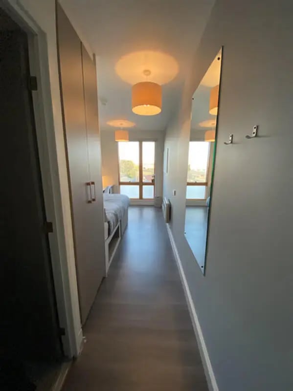 Bed wardrobe mirror hallway bedroom at Charles Morton Court in London Student Accommodation