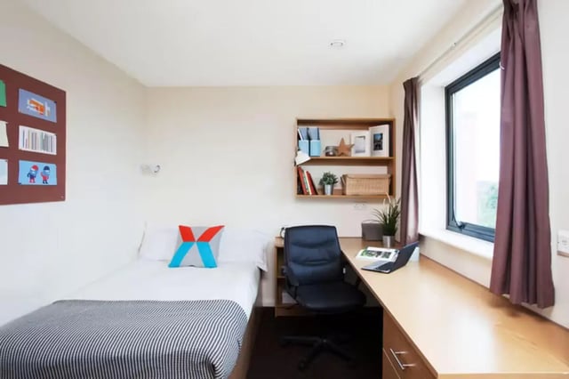 Bed desk chair shelf window bedroom at Waterways in Loughborough Student Accommodation