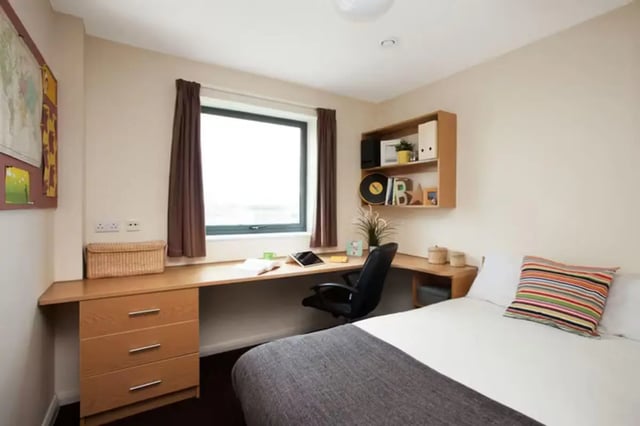 Desk drawers bed pillows and shelves bedroom at Waterways in Loughborough Student Accommodation