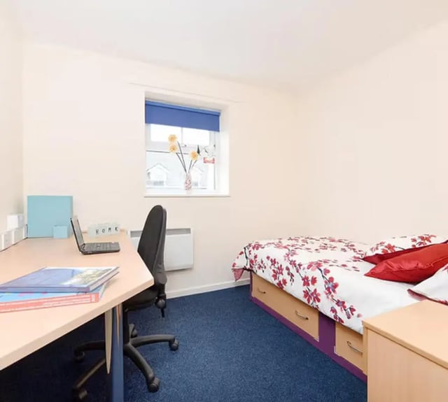 Desk laptop chair and bed student bedroom at Snowdon Hall in Wrexham Student Accommodation