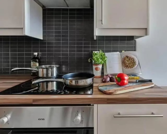 Pots pans pepper cookbook kitchen at The Mews in Oxford Student Accommodation