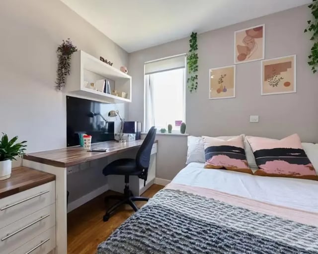 Desk with chair and bed bedroom interior at The Mews in Oxford Student Accommodation