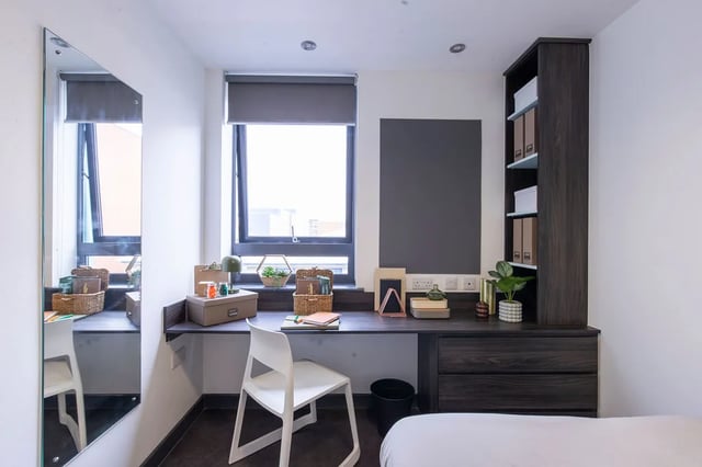 Desk with chair and shelves study area at The Foundry Newcastle in Newcastle Upon Tyne Student Accommodation