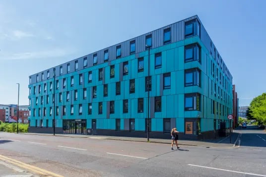 Modern blue student accommodation building with many windows exterior at The Foundry Newcastle in Newcastle Upon Tyne Student Accommodation