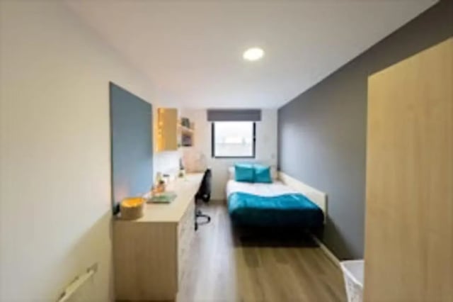 Desk bed blue bedding pillows study bedroom at Trinity Square in Nottingham Student Accommodation