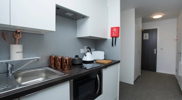 Kitchen counter with kettle toaster sink and utensils kitchen at Fraser Studios in Aberdeen Student Accommodation