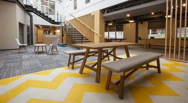 Wooden table and benches common area exterior at Fraser Studios in Aberdeen Student Accommodation