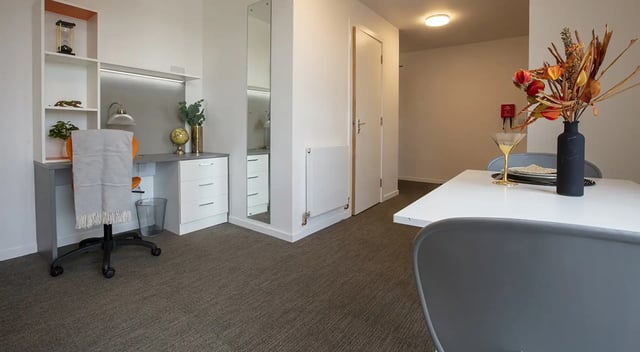 Desk chair shelving globe vase kitchen dining area at Fraser Studios in Aberdeen Student Accommodation