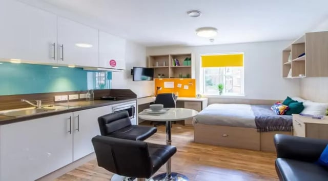 Kitchen bed desk study area living room bedroom at Iron Bridge Studios in Exeter Student Accommodation