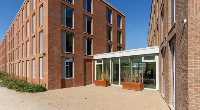 Modern brick buildings with glass entrance exterior at The Union Leamington in Leamington Spa Student Accommodation