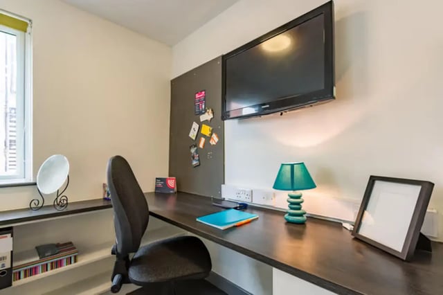 Desk chair lamp television framed photo study area at Russell View in Nottingham Student Accommodation