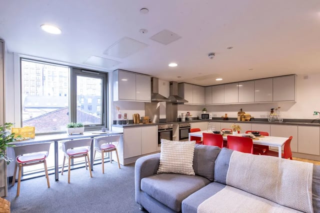 Sofa dining table and kitchen counter kitchen at Bailey Street in Sheffield Student Accommodation