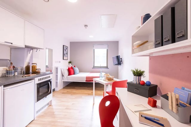 Kitchen bed desk with red chairs student room at Bailey Street in Sheffield Student Accommodation