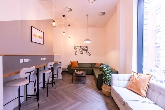 Bar stools with table and couches living room at Bailey Street in Sheffield Student Accommodation