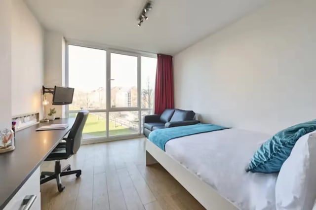 Bed desk sofa with large window bedroom at Upperton Road in Leicester Student Accommodation