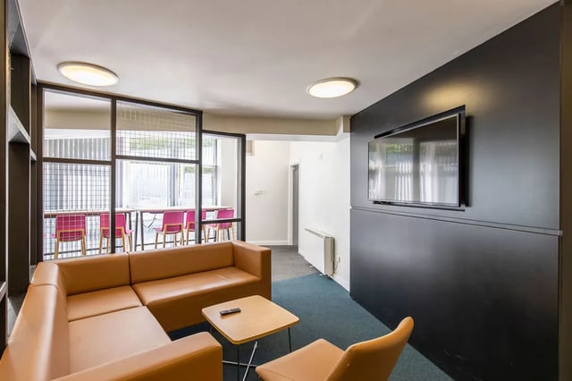 Brown sofa and chairs with table living room at Charlotte Court in Sheffield Student Accommodation