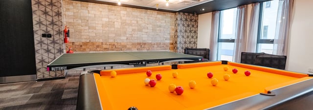Pool table ping pong table and seating area recreation area at Chapter Ealing in London Student Accommodation