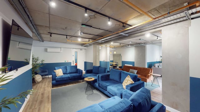 Blue couches orange sofa lounge area living room at Mayfield Residences in Edinburgh Student Accommodation