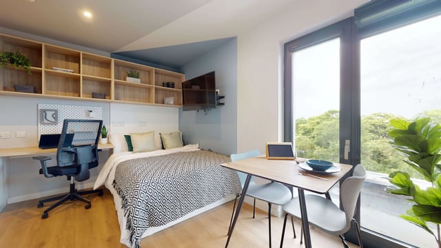 Desk bed shelves table chairs with window view bedroom at Mayfield Residences in Edinburgh Student Accommodation