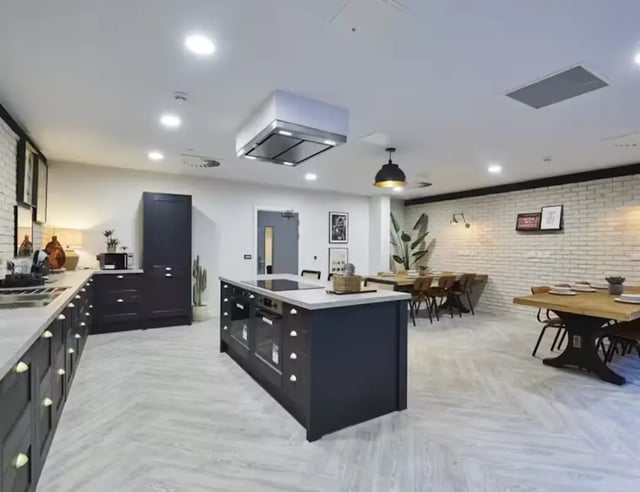 Modern island kitchen with dining tables living room at York House in Nottingham Student Accommodation